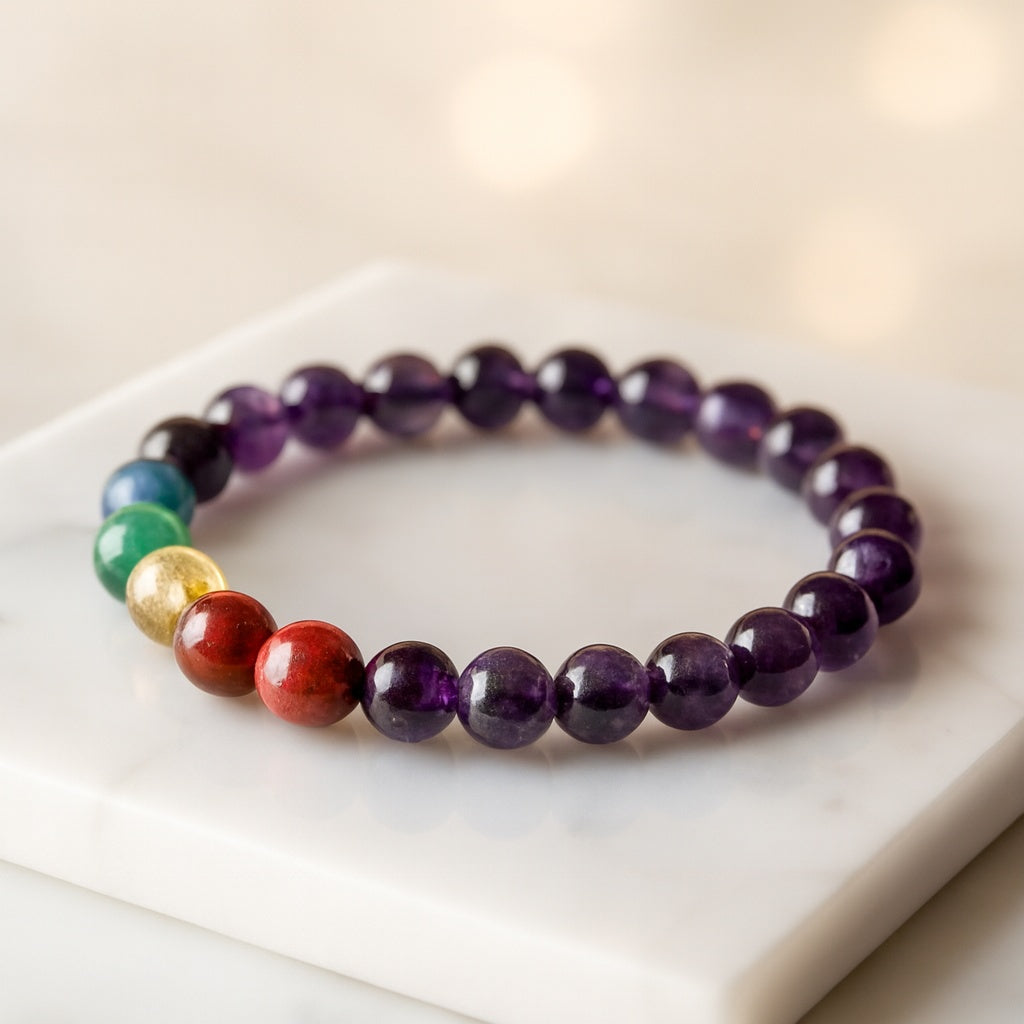 Authentic 7 Chakra Amethyst Gemstone Bracelet with natural crystal inclusions on white marble